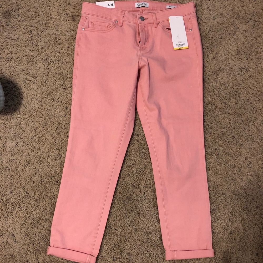 Pink cropped stretchy jeans.